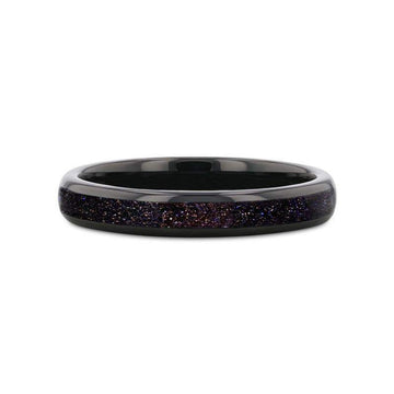 Flat lay of ASTRUM black tungsten ring highlighting the crushed blue and purple goldstone inlay, 4mm