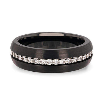 Flat lay of the domed black tungsten carbide ring highlighting the continuous white sapphire channel.