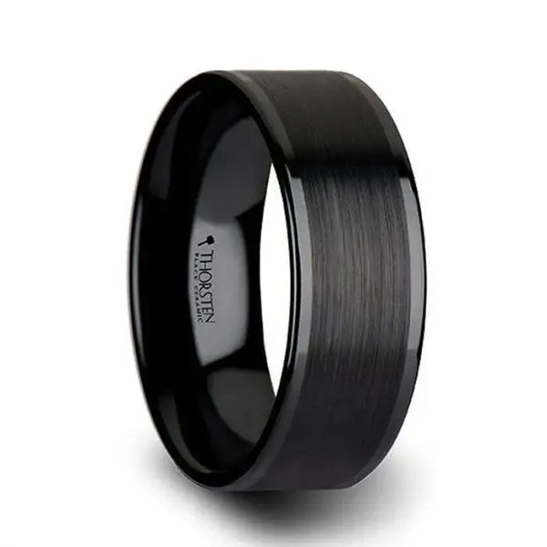 Angled view highlighting the brushed matte center band and polished edges on a black ceramic ring