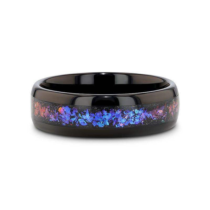 COSMIC black tungsten ring, flat-lay showing polished black finish and multicolor crushed inlay