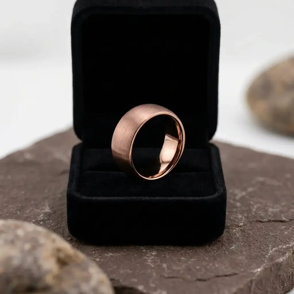 Domed rose gold tungsten band with brushed finish displayed in black velvet ring box.