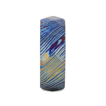 Side profile of the 8mm brushed titanium ring showing blue, purple, and gold wavy stripes