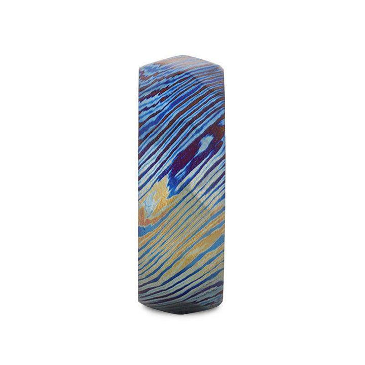 Side profile of the 8mm brushed titanium ring showing blue, purple, and gold wavy stripes
