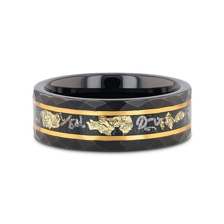 Flat lay of INFINIA 8mm black tungsten ring highlighting meteorite and gold flake inlay with gold-tone borders