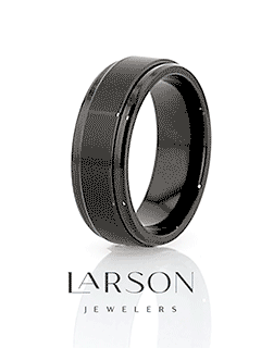Video thumbnail: rotating view of the REVOLVE black tungsten spinner ring showing spinning center band