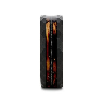 Front view of the black tungsten ring highlighting the centered guitar string between charred whiskey barrel wood inlays