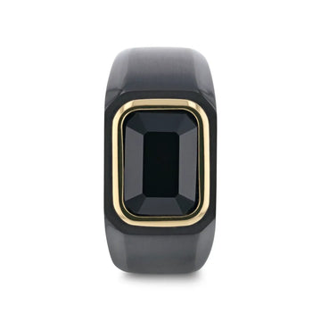 Front view of the black titanium signet ring showing the emerald-cut black onyx bordered by gold plating