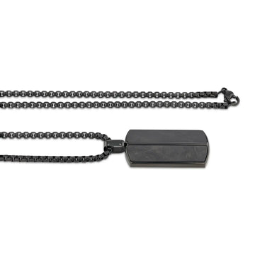 Side view of the black stainless steel pendant with carbon fiber inlays, shown with the full 22-inch matching chain and clasp