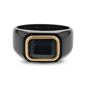Top view of the black titanium signet ring with gold-plated bezel around a black onyx inlay