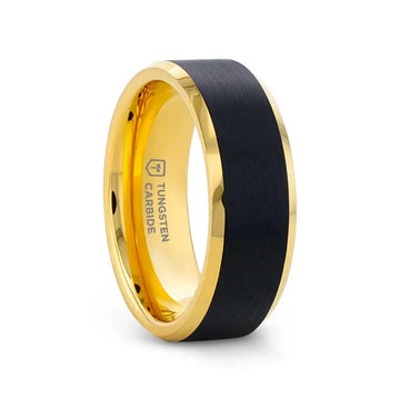 Gold-plated tungsten carbide ring with brushed black center and polished beveled edges, angled view