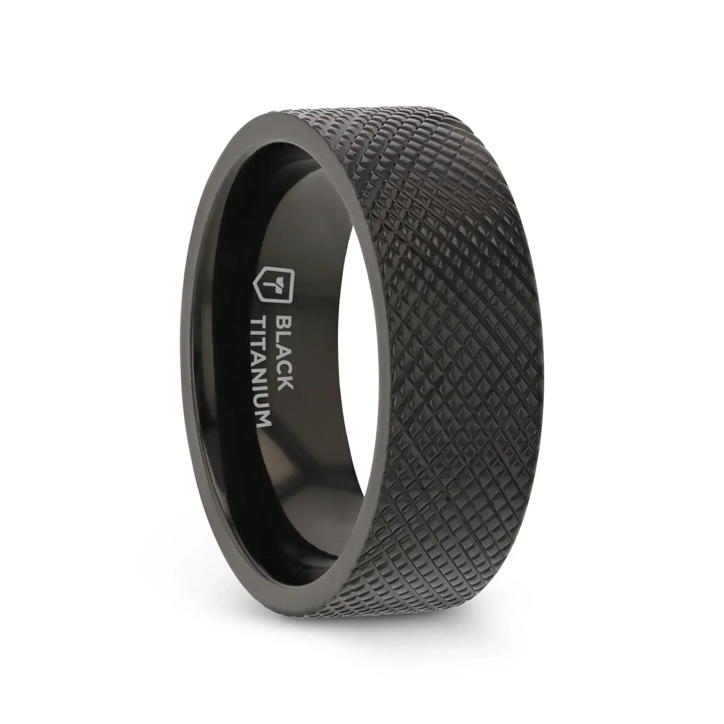 Angled view of an 8mm flat black titanium ring featuring a rugged knurled texture and polished interior with “BLACK TITANIUM” marking