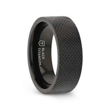 Angled view of an 8mm flat black titanium ring featuring a rugged knurled texture and polished interior with “BLACK TITANIUM” marking
