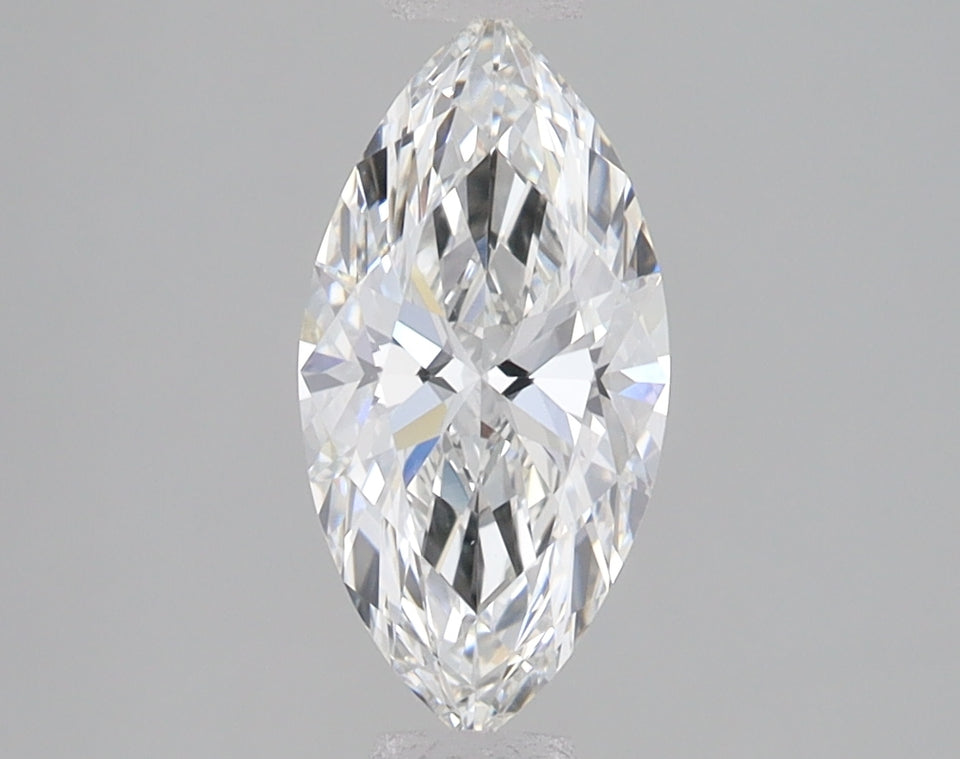 Marquise cut lab-grown diamond with faceted surfaces displaying light reflections on neutral gray background.