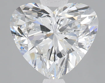 Heart-shaped lab-grown diamond with brilliant faceting and light reflections on gray background.
