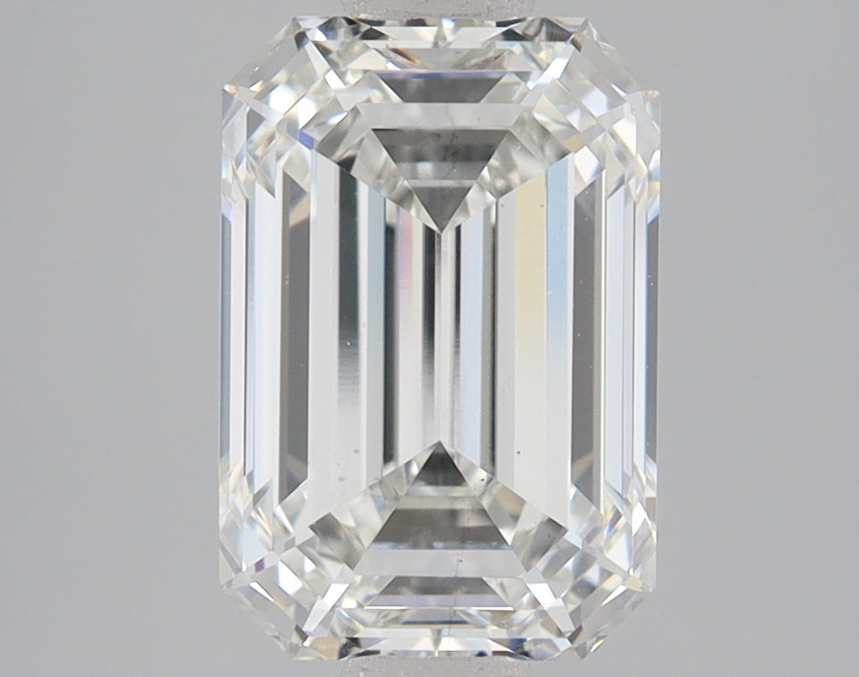 Emerald-cut lab-grown diamond with faceted sides and clear appearance, displayed on neutral gray background.