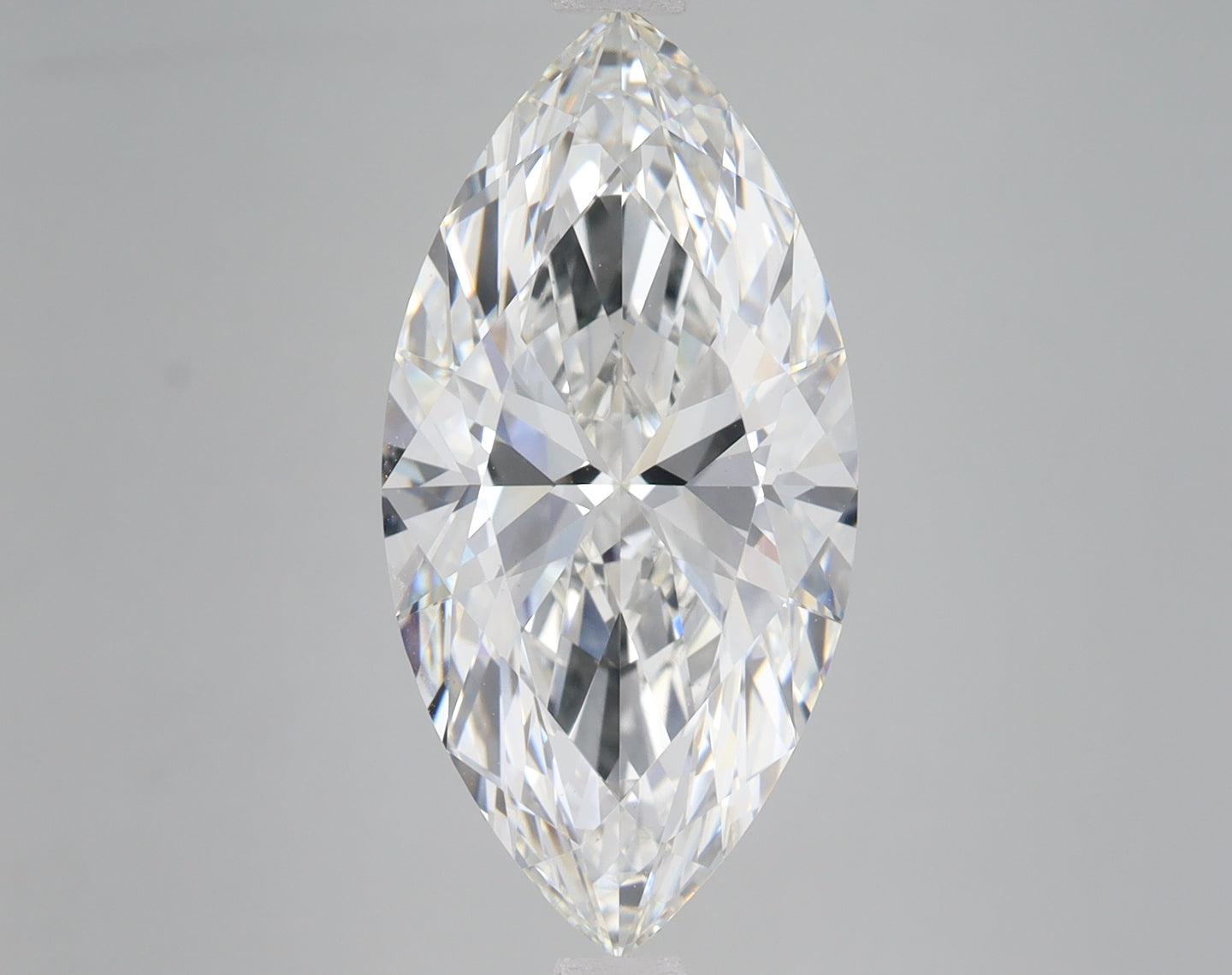 Marquise-cut clear lab-grown diamond with faceted surfaces on neutral background.