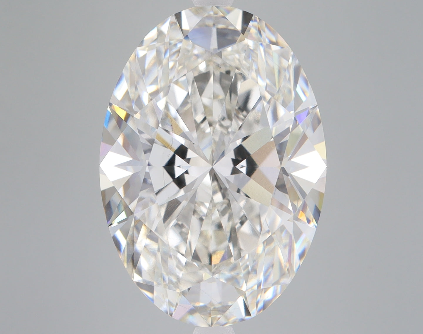 Clear oval-cut diamond with brilliant faceting and light refraction displayed against a neutral background.
