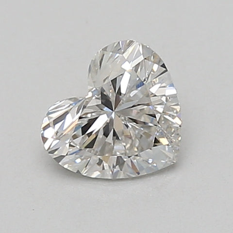 Heart-shaped lab-grown diamond loose stone, 0.73 carat, displaying faceted surface and light refraction.