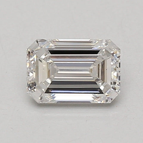 Emerald-cut lab-grown diamond loose stone with faceted surfaces and light reflection on neutral background.