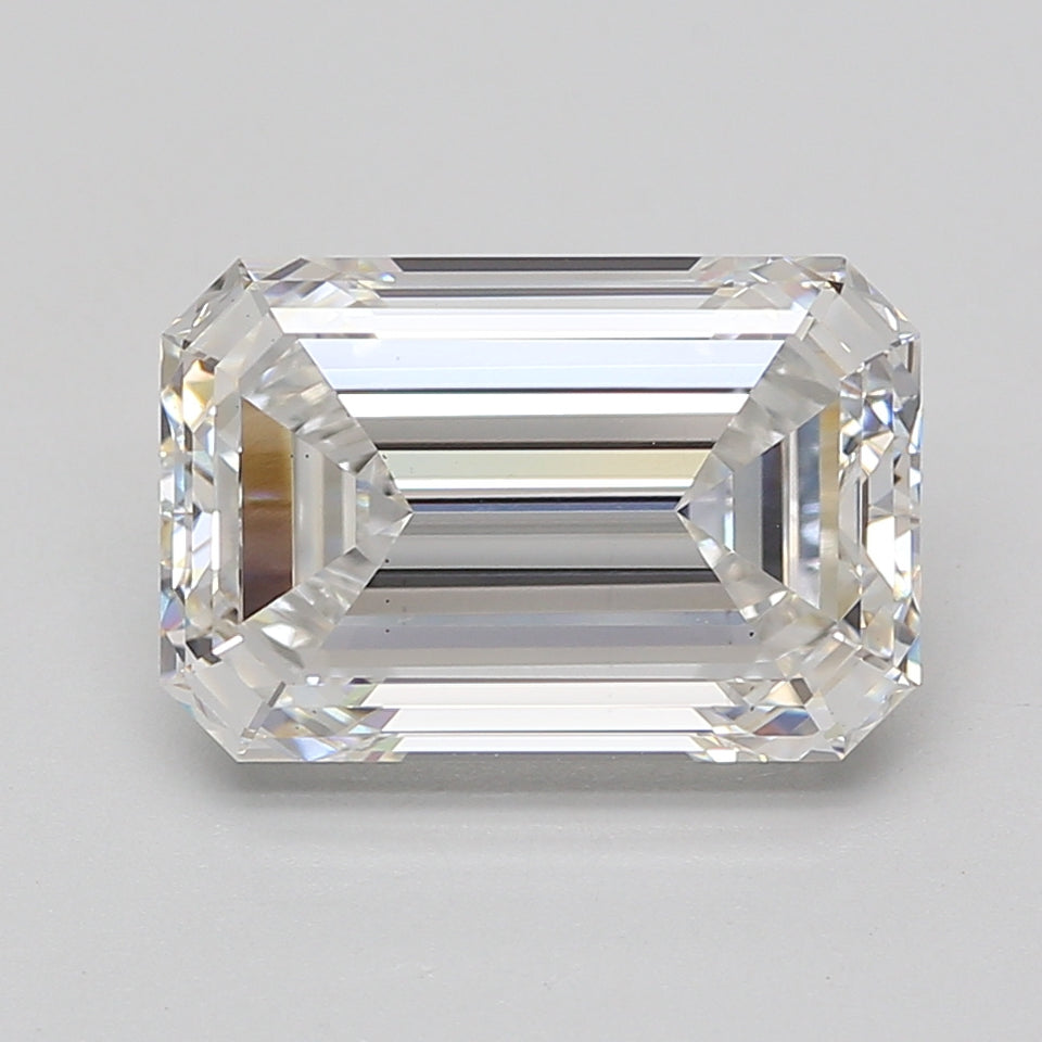 Emerald cut lab-grown diamond with step facets and clear appearance on neutral background.