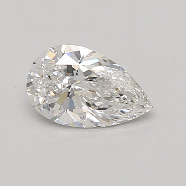 Pear-shaped lab-grown diamond with faceted surface and light reflections on neutral background.