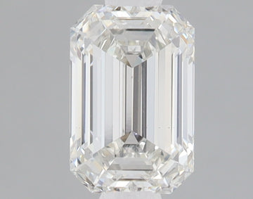 Clear emerald-cut lab-grown diamond with faceted surfaces and light reflections on neutral background.