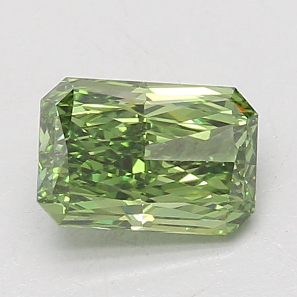 1.42 carat radiant cut lab-grown diamond with yellow-green hue and faceted surface on neutral background.