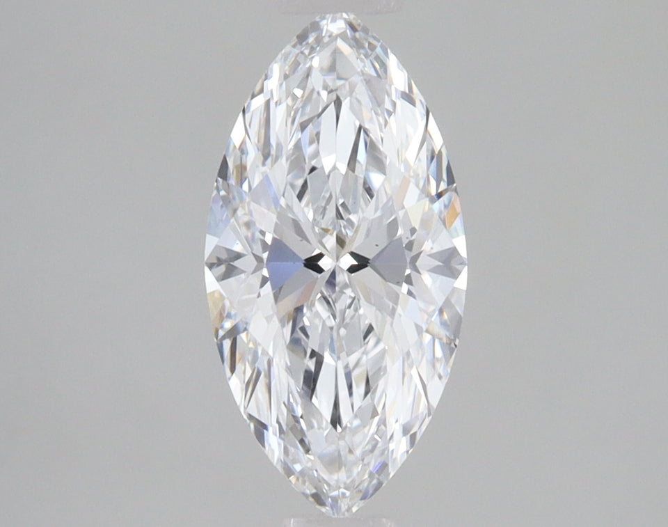 Marquise-cut clear diamond with faceted surface and pointed ends on neutral background.