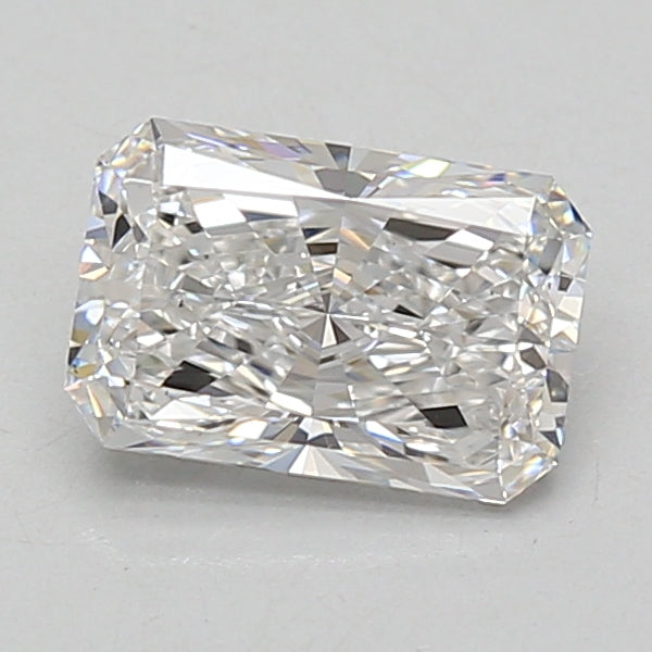 Radiant cut loose diamond stone with faceted surfaces reflecting light, displayed on neutral background.
