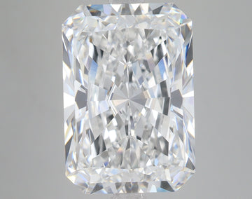 Radiant cut loose diamond with faceted surfaces displaying light refraction on neutral background.