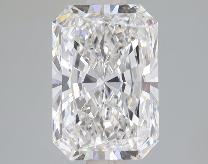 Radiant cut lab-grown diamond with brilliant faceting and light refraction on neutral gray background.