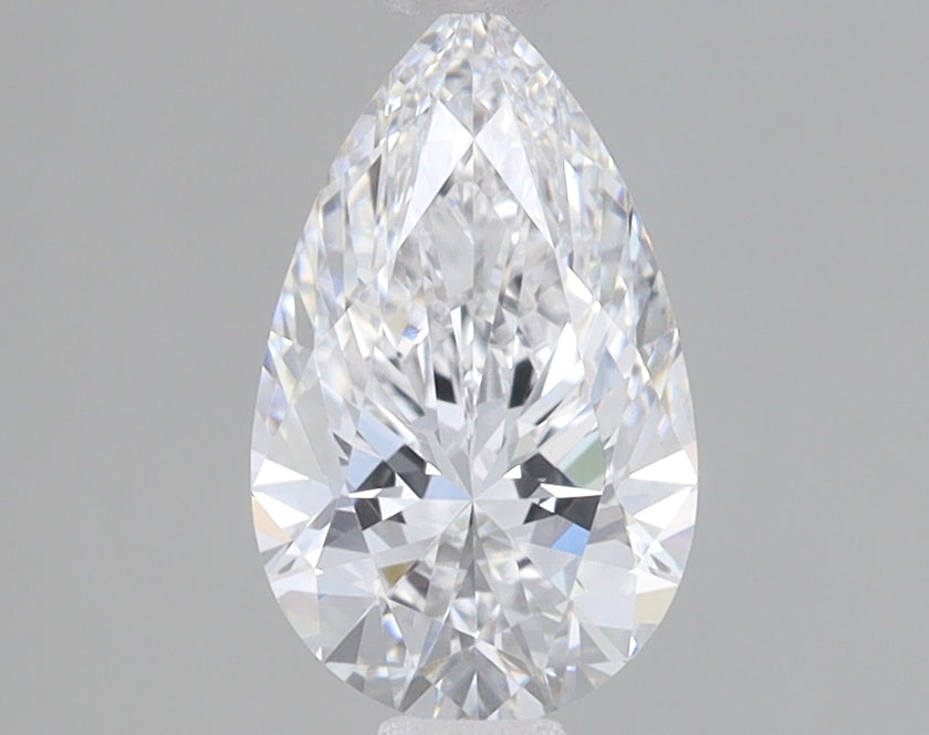 Clear pear-shaped lab-grown diamond with faceted surfaces displaying light refraction on gray background.