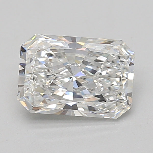 Clear radiant cut loose diamond with faceted surfaces reflecting light, displayed against neutral gray background.