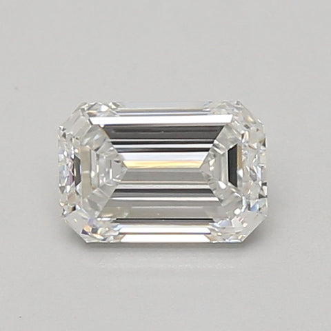 Emerald-cut lab-grown diamond with faceted surface and step-cut pattern on neutral background.