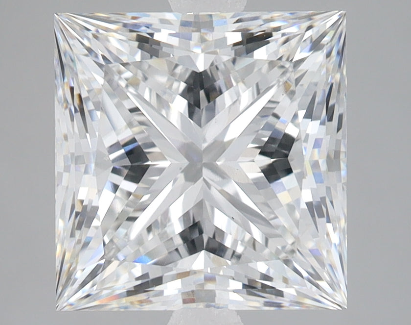 Princess-cut lab-grown diamond with faceted surface displaying light refraction and sparkle against neutral background.