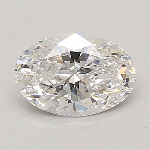 Clear oval-cut diamond with faceted surface reflecting light against gray background.
