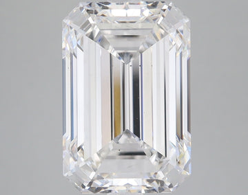 Colorless emerald-cut loose stone with faceted sides and reflective surfaces on neutral background.