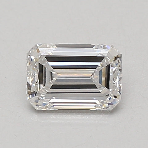 Emerald-cut lab-grown diamond loose stone with faceted edges and clear transparency on neutral background.
