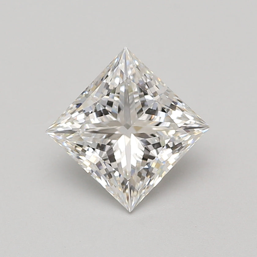 Princess cut lab-grown diamond with square faceted shape and light reflection, displayed against neutral background.