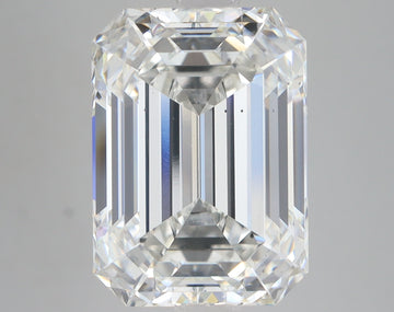 Emerald-cut lab-grown diamond with faceted surfaces reflecting light, displayed against neutral background.