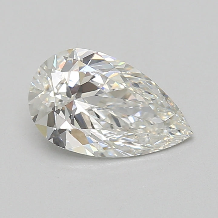 Pear-shaped clear lab-grown diamond with faceted surface reflecting light, displayed against neutral background.