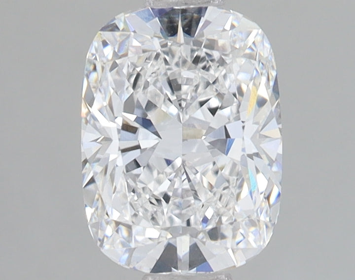 Cushion-cut lab-grown diamond with faceted surface and light refraction, displayed against gray background.