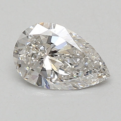 Pear-shaped lab-grown diamond with faceted surfaces and light reflections on neutral background.