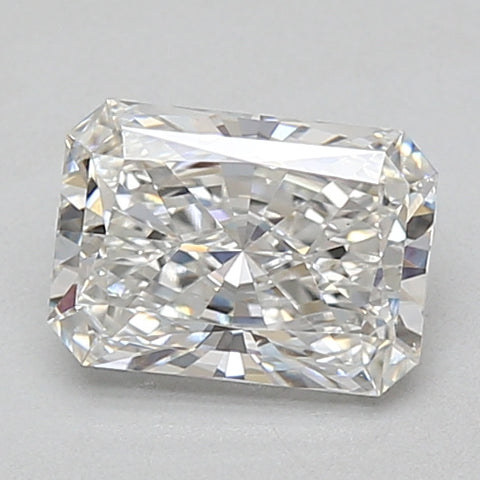 Radiant cut loose diamond with faceted surfaces reflecting light, displayed on neutral background.