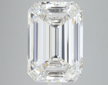 Emerald-cut lab-grown diamond with clear faceting and light reflections on neutral background.