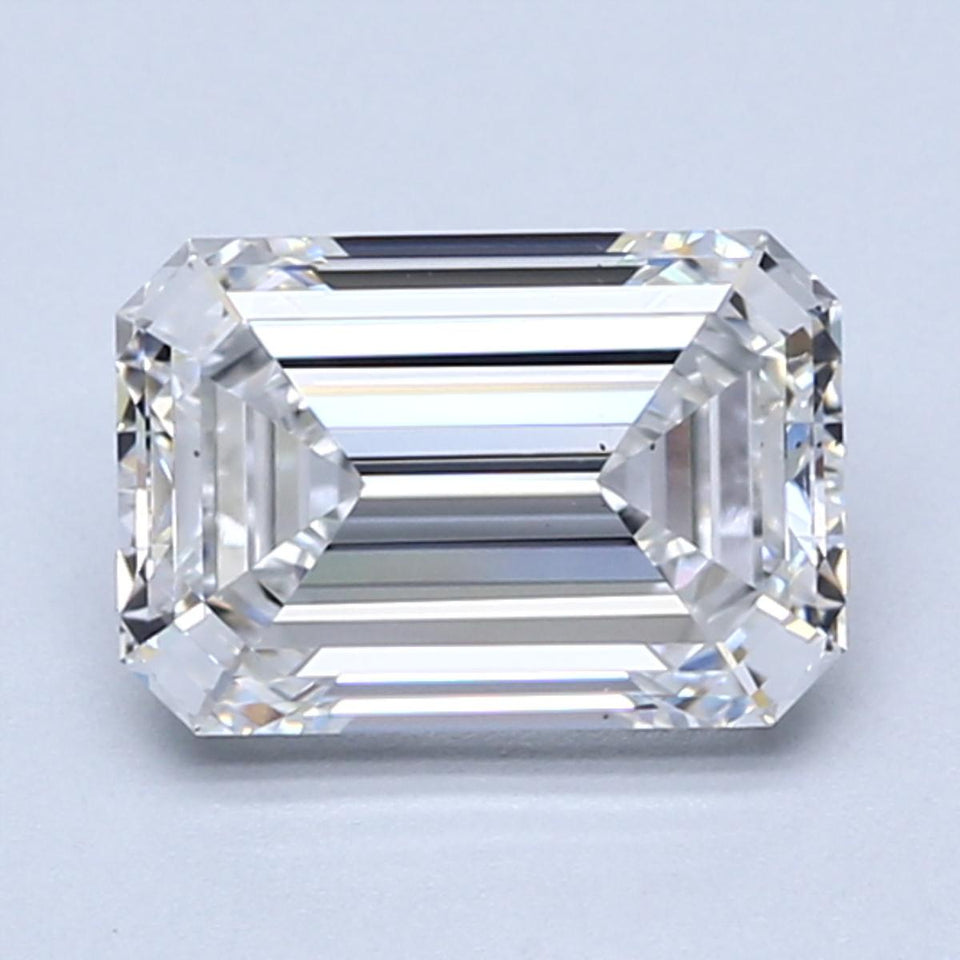 Emerald-cut lab-grown diamond with faceted surfaces and clear transparency, displaying light refraction patterns on light bac