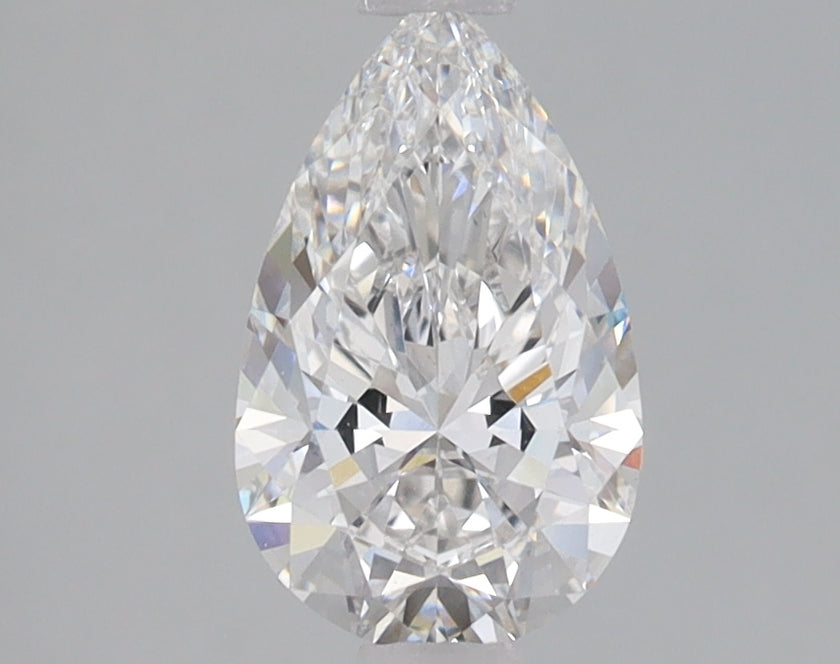 Pear-shaped lab-grown diamond with faceted cut, displaying light refraction and brilliance.