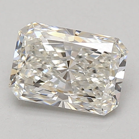 Radiant cut loose diamond with faceted surface displaying light refraction, colorless appearance on neutral background.