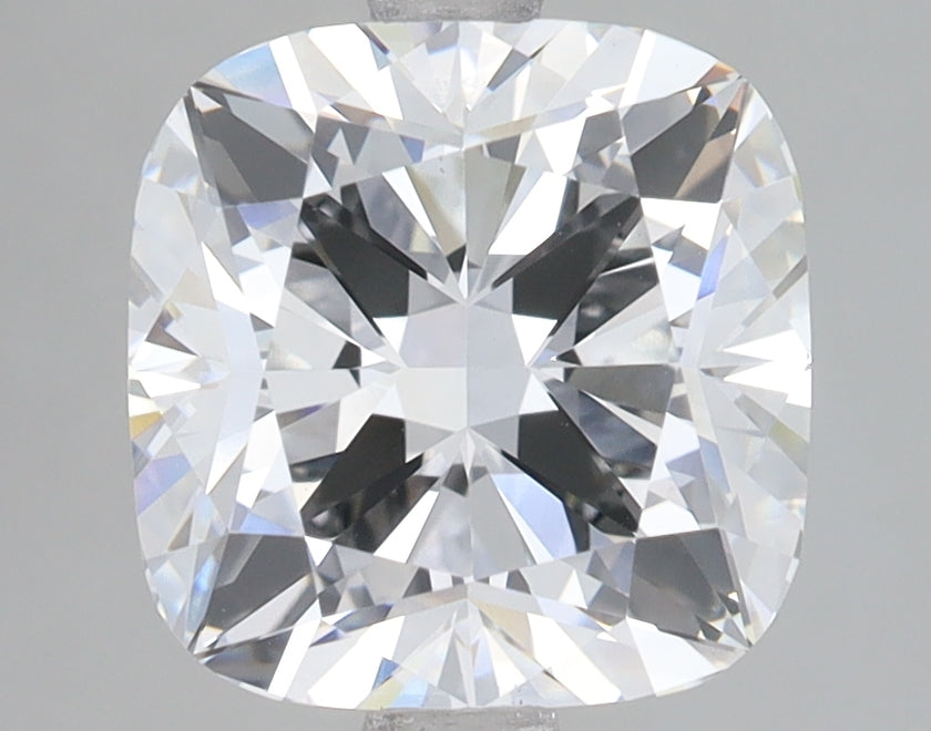 Cushion-cut lab-grown diamond with faceted surfaces displaying light refraction and reflections on neutral background.
