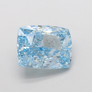 Cushion-cut lab-grown diamond with light blue tint and faceted surface, displayed on neutral background.